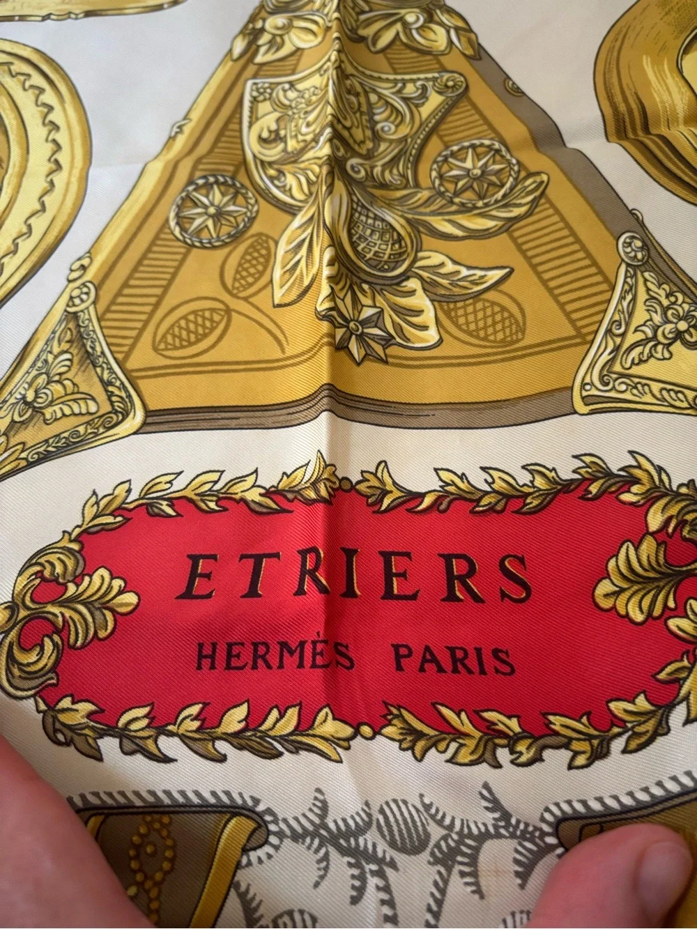 Hermès silk scarf in gold, red and black ornate print